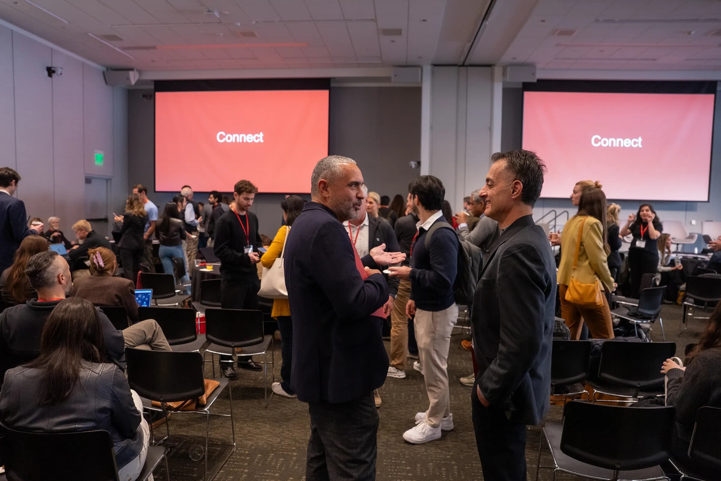 Attendees networking under twin red Connect screens at SMCHC 2026