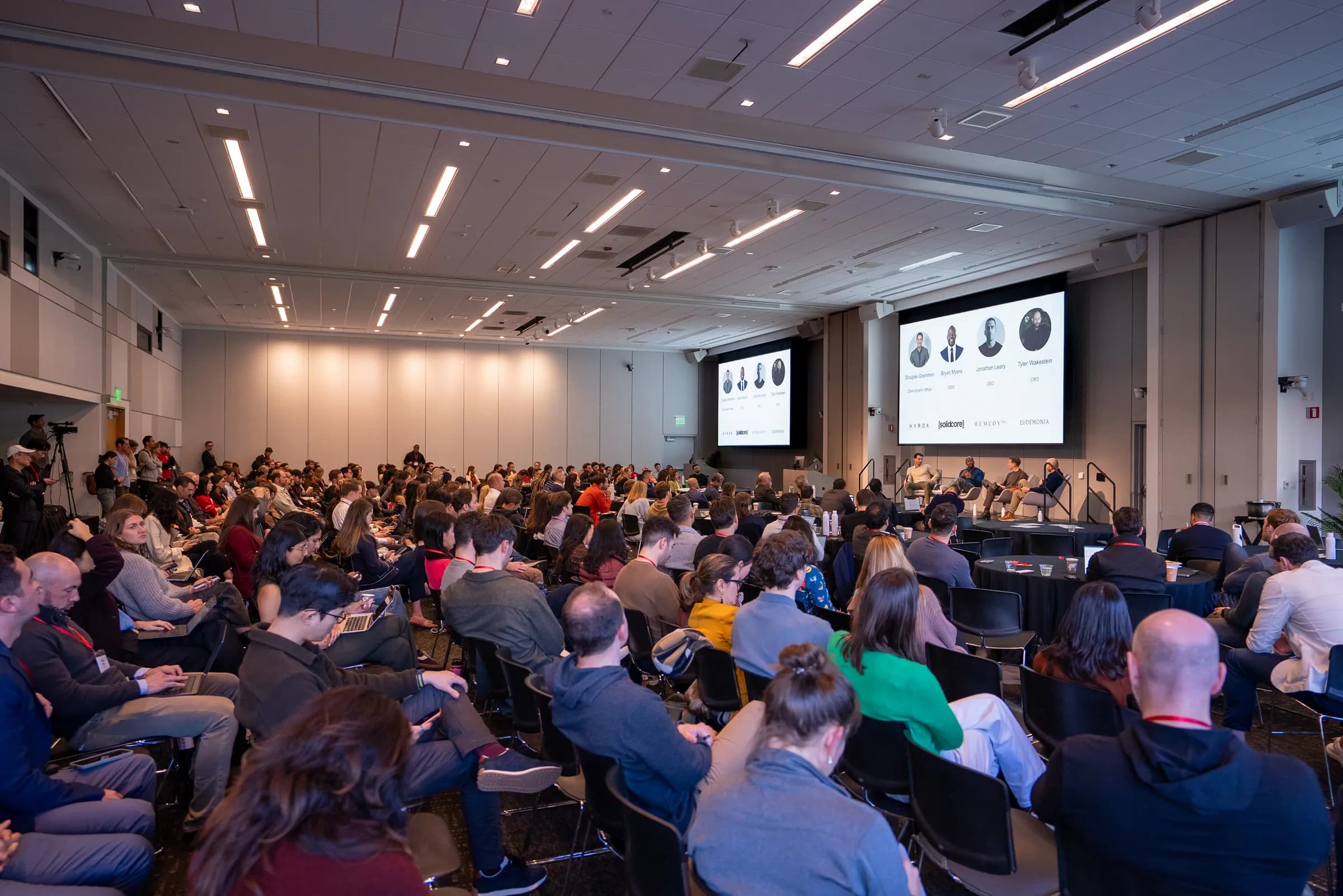 A packed Berg Hall watching a panel on stage at SMCHC 2026